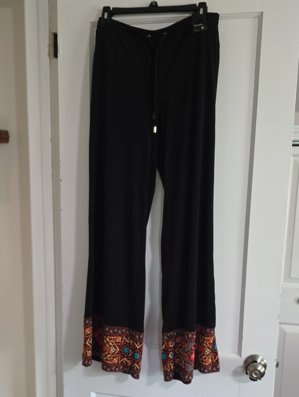 NY & Company black wide leg palazzo pants with colorful patterned at bottom